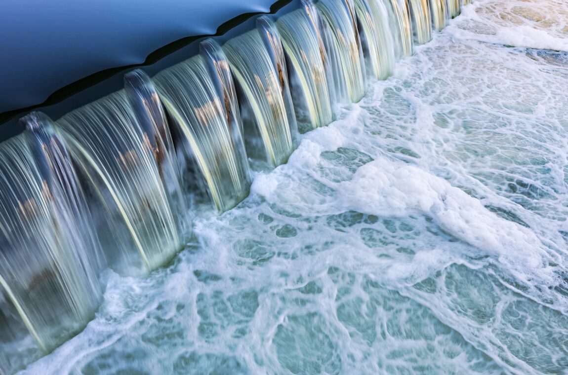 Flowing water, the water flows down a small step from a higher calm pool, below you can see foaming water