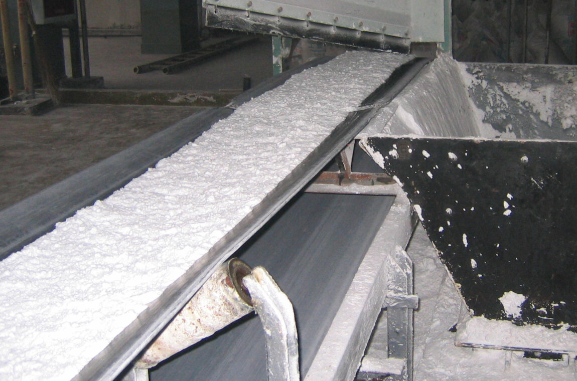 Sodium bicarbonate or sodium hydrogen carbonate in powder form on a conveyor belt