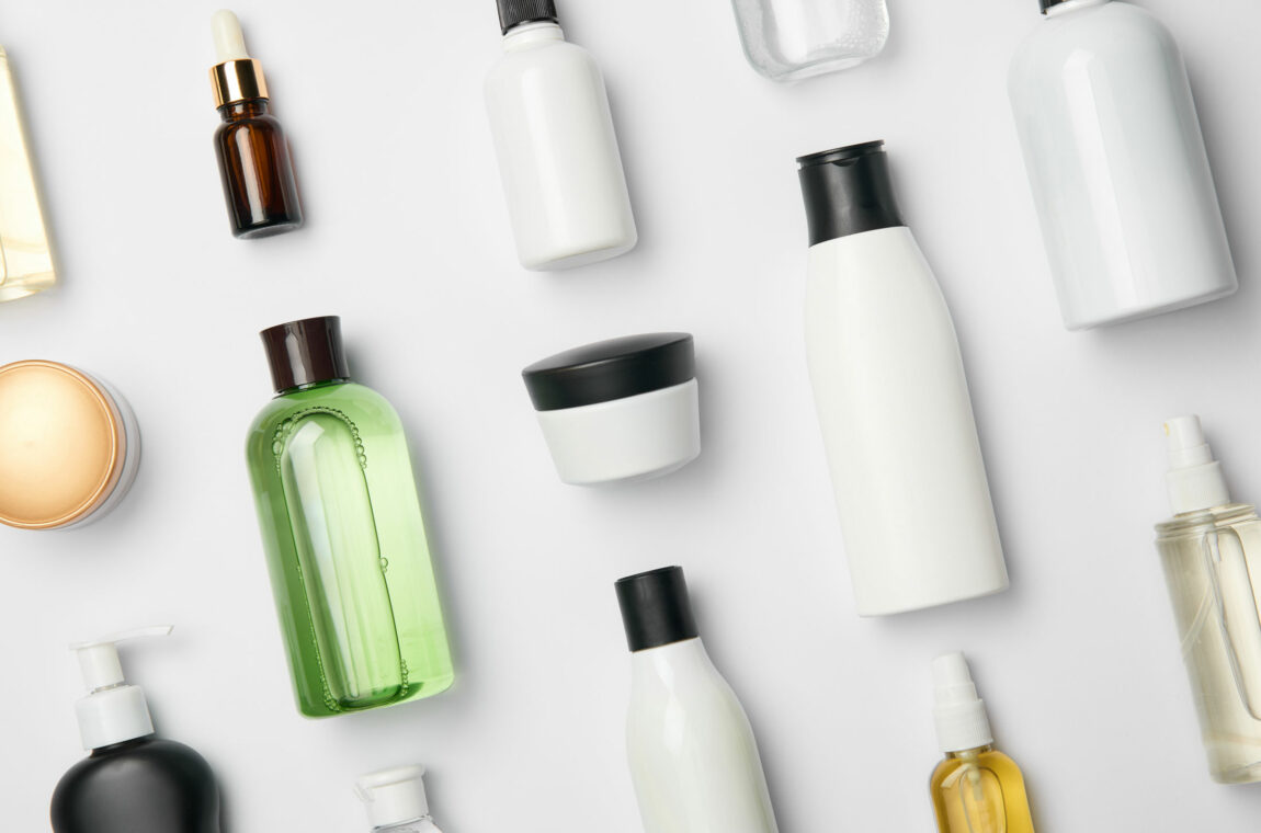 Cosmetics. Various containers for cosmetics on a white background. Cream jars, tubes, bottles and spray bottles