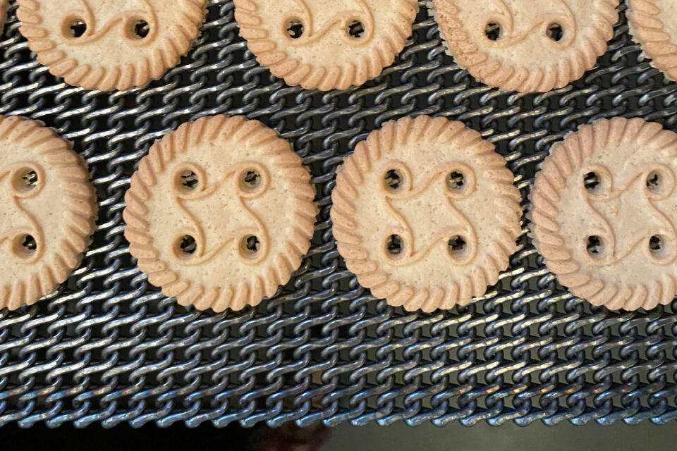 STEINHAUS rolled baking belts with cookies after baking in the tunnel oven